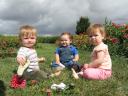 Sylvan, Viggo, and Helen in the flowers