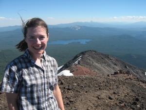 Julie enjoys the views from Diamond Peak’s summit. Thielsen in background.