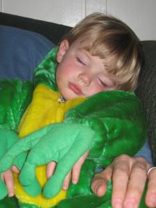 Sylvan fell asleep in a toasty frog costume in Dad’s arms