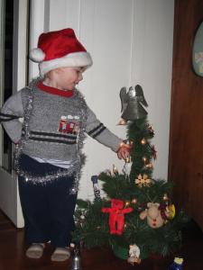 Sylvan is taller than his Christmas tree