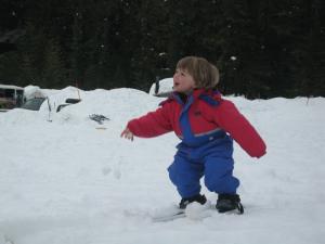 Sylvan throwing a snowball at Mom