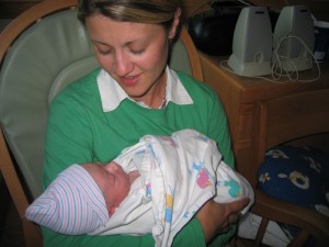 All cleaned up and asleep in Aunt Jenn's arms after the difficult business of being born